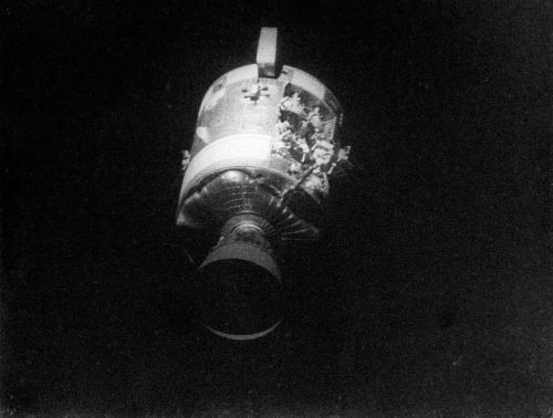 AS13-59-8500A (17 April 1970) --- This view of the severely damaged Apollo 13 Service Module (SM) was photographed from the Lunar Module/Command Module (LM/CM) following SM jettisoning. As seen in this cropped image, enlarged to provide a close-up view of the damaged area, an entire panel on the SM was blown away by the apparent explosion of oxygen tank number two located in Sector 4 of the SM. Two of the three fuel cells are visible just forward (above) the heavily damaged area. Three fuel cells, two oxygen tanks, and two hydrogen tanks are located in Sector 4. The damaged area is located above the S-Band high gain antenna. Nearest the camera is the Service Propulsion System (SPS) engine and nozzle. The damage to the SM caused the Apollo 13 crew members to use the LM as a "lifeboat". The LM was jettisoned just prior to Earth re-entry by the CM. Photo credit: NASA